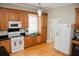 Kitchen showcasing stainless steel appliances, granite countertops, and natural wood cabinets at 187 Pecan Dr, Summerville, SC 29483