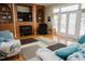 Comfortable living room with a fireplace, built-in shelving, and a cozy seating area at 187 Pecan Dr, Summerville, SC 29483