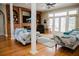 Open living room featuring fireplace, hardwood flooring, and access to sunroom at 187 Pecan Dr, Summerville, SC 29483