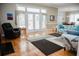 Spacious living room with hardwood floors, a modern rug, and comfortable seating, perfect for relaxation at 187 Pecan Dr, Summerville, SC 29483