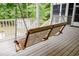 Relaxing porch swing on a screened porch, perfect for enjoying the outdoors at 187 Pecan Dr, Summerville, SC 29483