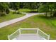Elevated porch view overlooking the manicured front lawn and driveway, framed by white railings at 187 Pecan Dr, Summerville, SC 29483