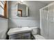 Simple bathroom featuring a single sink vanity, toilet, shower and window at 1925 Belgrade Ave, Charleston, SC 29407