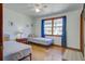 Bright bedroom with hardwood floors, lots of natural light, and twin beds at 1925 Belgrade Ave, Charleston, SC 29407