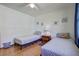 Bright bedroom with two twin beds, wood floors and beach-themed decor at 1925 Belgrade Ave, Charleston, SC 29407