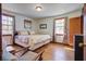 Spacious bedroom featuring wood floors, a queen bed, and large windows with natural light at 1925 Belgrade Ave, Charleston, SC 29407