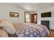 Cozy bedroom with wood floors, a queen bed, and mounted TV at 1925 Belgrade Ave, Charleston, SC 29407
