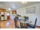 Bright eat-in kitchen featuring wood cabinetry, a glass top table, and a view of the backyard at 1925 Belgrade Ave, Charleston, SC 29407
