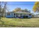 Quaint single-story home with a welcoming front porch and green lawn at 1925 Belgrade Ave, Charleston, SC 29407