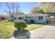Charming single-story home with a well-manicured lawn and driveway at 1925 Belgrade Ave, Charleston, SC 29407
