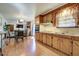 Spacious kitchen showcasing classic wood cabinets, ample counter space, and seamless flow into the living areas at 1925 Belgrade Ave, Charleston, SC 29407