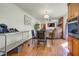 Open-concept kitchen flowing into the living room with a brick fireplace and an entertainment setup at 1925 Belgrade Ave, Charleston, SC 29407