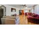 Bright living room featuring hardwood floors and a view into the dining area at 1925 Belgrade Ave, Charleston, SC 29407