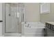 The bathroom features a tub and separate glass shower at 1996 Wild Indigo Way, Hanahan, SC 29410