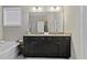 The bathroom has a dual sink vanity with granite countertops at 1996 Wild Indigo Way, Hanahan, SC 29410