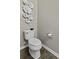 Cozy half-bathroom with toilet and decor at 1996 Wild Indigo Way, Hanahan, SC 29410