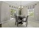 Cozy dining area with a round table, stylish chairs, and natural light from the sliding glass door at 1996 Wild Indigo Way, Hanahan, SC 29410