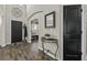 Welcoming foyer with elegant decor, dark doors, and a view into adjacent rooms at 1996 Wild Indigo Way, Hanahan, SC 29410