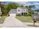 Charming two-story home with a well-manicured front yard, classic curb appeal, and attached two-car garage at 1996 Wild Indigo Way, Hanahan, SC 29410