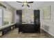 Well-lit home office features a large desk, built-in storage, and window seating at 1996 Wild Indigo Way, Hanahan, SC 29410