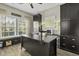 Spacious home office with custom built-ins, natural light, and a functional workspace at 1996 Wild Indigo Way, Hanahan, SC 29410
