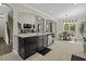 Open-concept kitchen with island, stainless steel appliances, and adjacent dining area at 1996 Wild Indigo Way, Hanahan, SC 29410