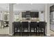 Well-designed kitchen with breakfast bar, stainless appliances, and dark cabinetry at 1996 Wild Indigo Way, Hanahan, SC 29410