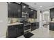 Modern kitchen features granite countertops, mosaic backsplash, and stainless steel appliances at 1996 Wild Indigo Way, Hanahan, SC 29410