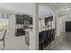 Modern kitchen with black cabinets, granite countertops, stainless steel appliances, and an eat-in island at 1996 Wild Indigo Way, Hanahan, SC 29410