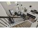 Open-concept living room featuring staircase and a view of the kitchen and dining area at 1996 Wild Indigo Way, Hanahan, SC 29410