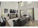 Spacious living room boasting high ceilings, large windows, and comfortable seating arrangements at 1996 Wild Indigo Way, Hanahan, SC 29410