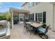 Outdoor dining area with grill, dining table set, and view into screened porch for entertaining at 1996 Wild Indigo Way, Hanahan, SC 29410