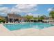 Large community pool with ample seating and a clubhouse for residents to enjoy on a sunny day at 1996 Wild Indigo Way, Hanahan, SC 29410