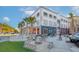 Exterior of a trendy brewery with outdoor seating, a fire pit, and vibrant architectural design at 1996 Wild Indigo Way, Hanahan, SC 29410