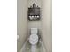 Small toilet room with neutral-toned walls, floating storage, and tile floors at 1996 Wild Indigo Way, Hanahan, SC 29410