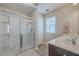 Bathroom features a large glass shower, dual vanities, and a window for natural light at 2001 Poplar Grove Pl, Summerville, SC 29483