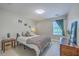 Cozy bedroom featuring neutral tones, hardwood floors, and natural light at 2001 Poplar Grove Pl, Summerville, SC 29483
