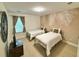 Bright bedroom with two twin beds, stylish decor, and natural light at 2001 Poplar Grove Pl, Summerville, SC 29483