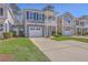 Attractive two-story home with garage and manicured lawn, offering curb appeal at 2001 Poplar Grove Pl, Summerville, SC 29483