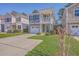 Charming two-story home featuring a garage, small porch, and manicured lawn at 2001 Poplar Grove Pl, Summerville, SC 29483