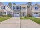 Charming two-story home featuring a balcony, one-car garage, and manicured lawn at 2001 Poplar Grove Pl, Summerville, SC 29483