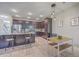 Kitchen featuring dark wood cabinets, an island with barstool seating, and an adjacent dining area at 2001 Poplar Grove Pl, Summerville, SC 29483