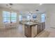 Open-concept kitchen with granite counters, stainless steel dishwasher, and views into the living room at 2001 Poplar Grove Pl, Summerville, SC 29483