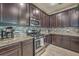 Close-up of kitchen featuring granite countertops, modern backsplash, and stainless steel stove at 2001 Poplar Grove Pl, Summerville, SC 29483