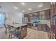 Bright kitchen features stainless steel appliances, granite countertops, and wood cabinets at 2001 Poplar Grove Pl, Summerville, SC 29483