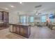 Open-concept living space featuring a kitchen island and spacious living room with large sectional at 2001 Poplar Grove Pl, Summerville, SC 29483