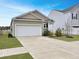 Charming single-Gathering home featuring a two car garage and a sidewalk for neighborhood strolls at 215 Sweet Cherry Ln, Summerville, SC 29486