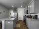 Bright kitchen with gray cabinets, stainless steel appliances, and a granite-topped island at 215 Sweet Cherry Ln, Summerville, SC 29486