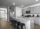 Kitchen featuring stainless steel appliances, granite countertops, and gray cabinets at 215 Sweet Cherry Ln, Summerville, SC 29486