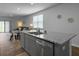 Open kitchen with stainless steel appliances, granite countertops, and dining area at 215 Sweet Cherry Ln, Summerville, SC 29486